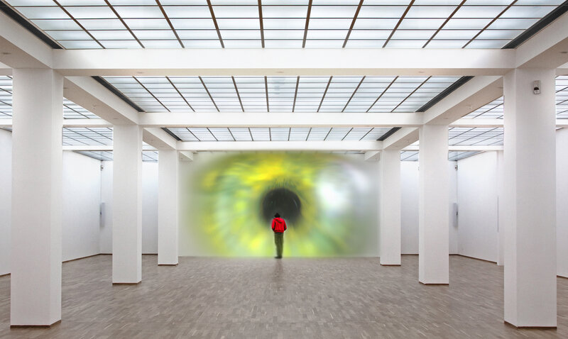 Person in art gallery with eye projection