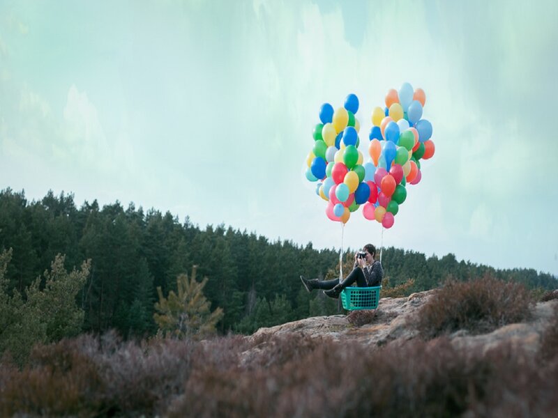 Person in Basket with Balloons