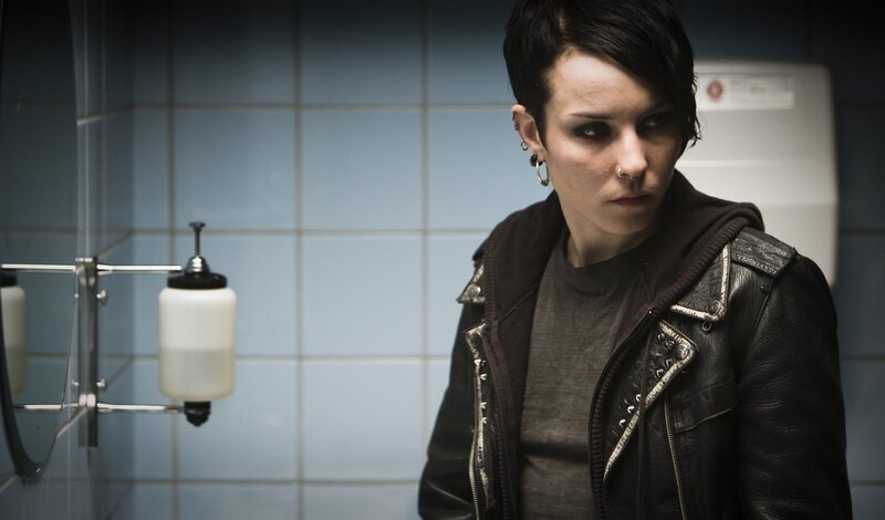 person in bathroom wearing leather jacket