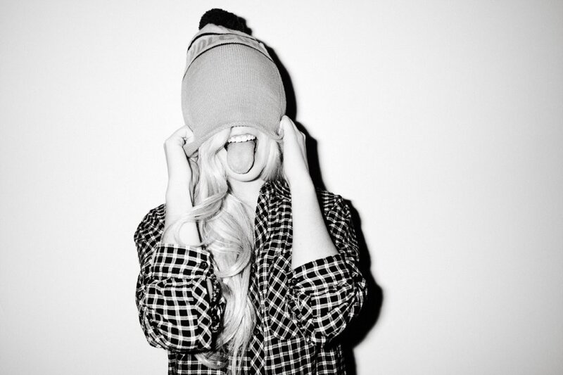 person in beanie with tongue out