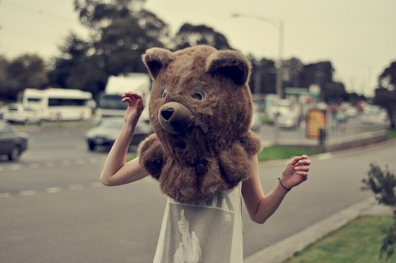 person in bear costume on street