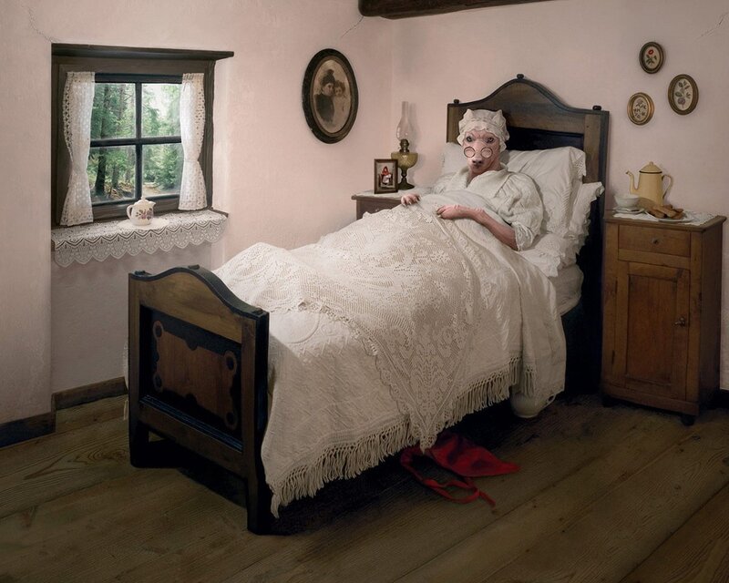 person in bed with animal mask