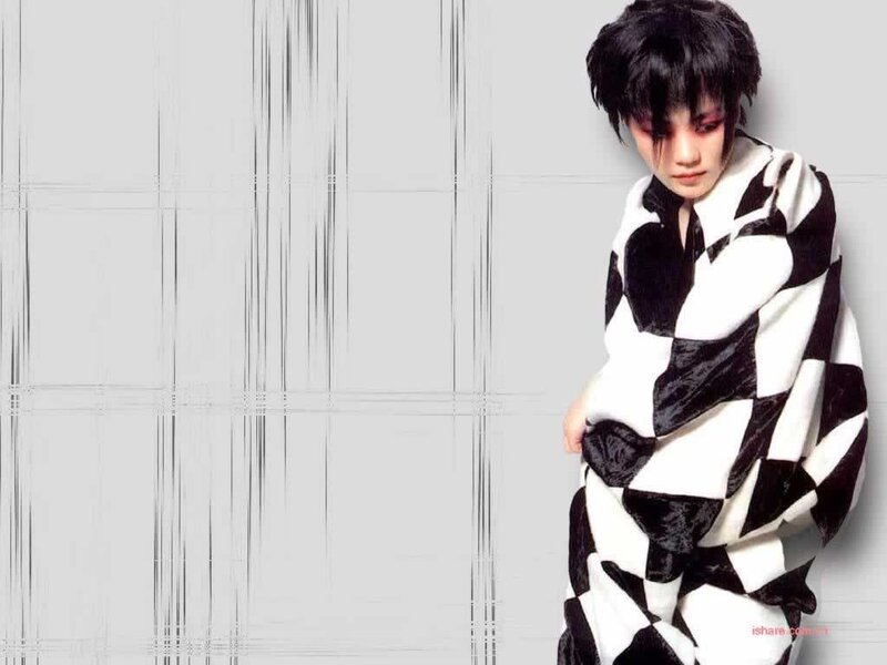 person in black and white patterned garment