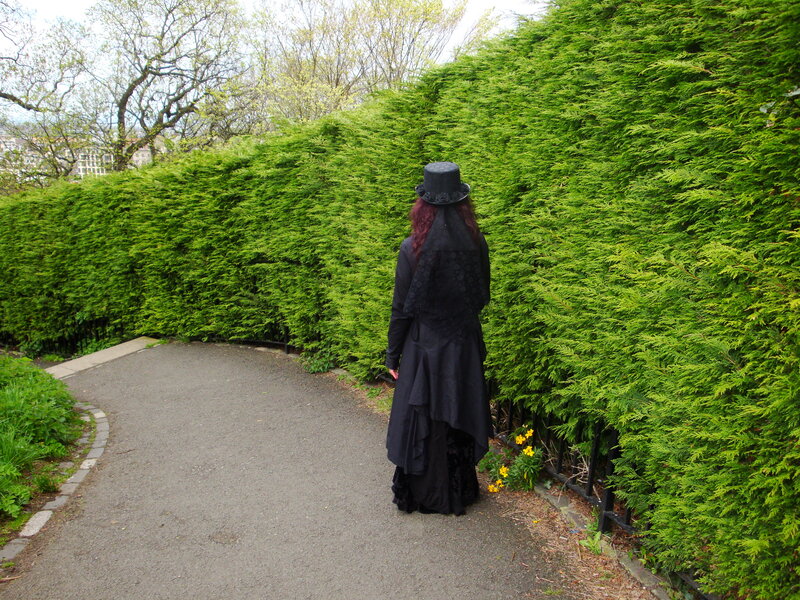 Person in black attire on path