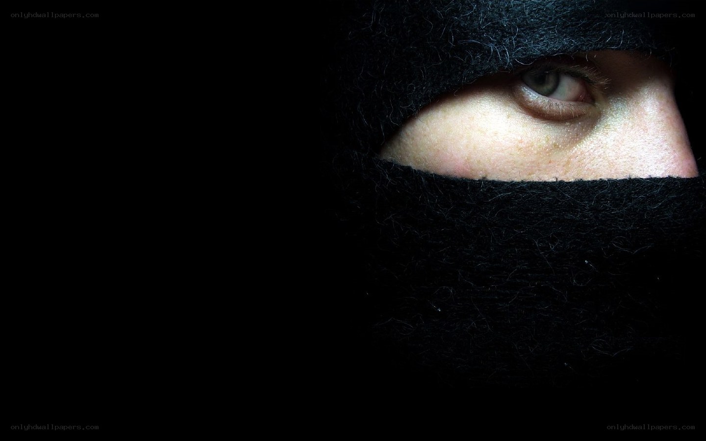 person in black balaclava