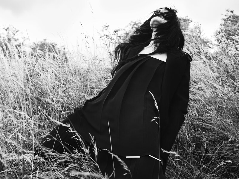 Person in Black Coat — Dramatic