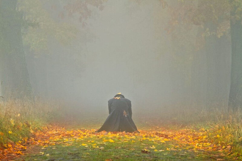 Person in Black Coat — Green