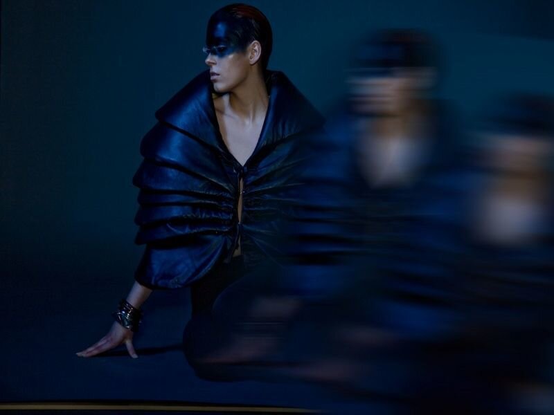 Person in Black Costume — Blue