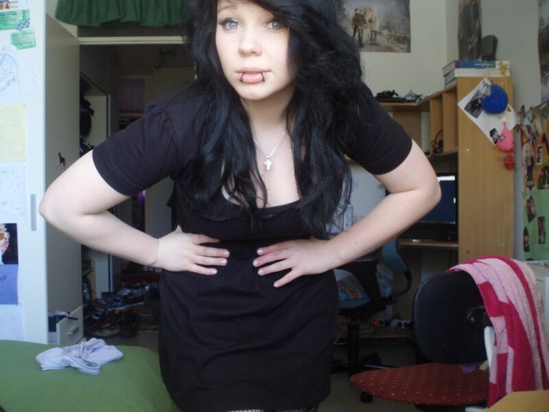 person in black dress standing