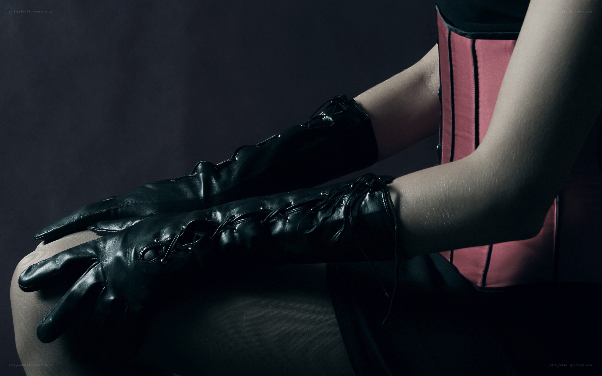 person in black gloves