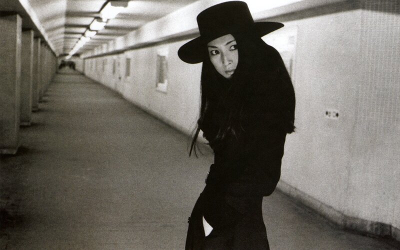 person in black hat in tunnel