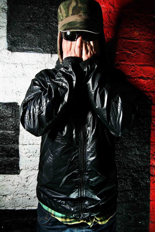 person in black jacket covering face
