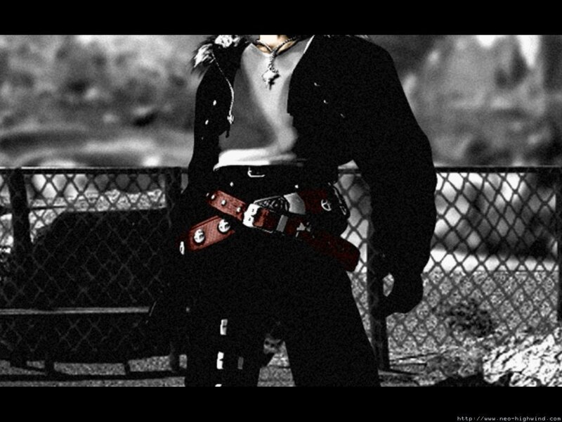 person in black jacket with red belt
