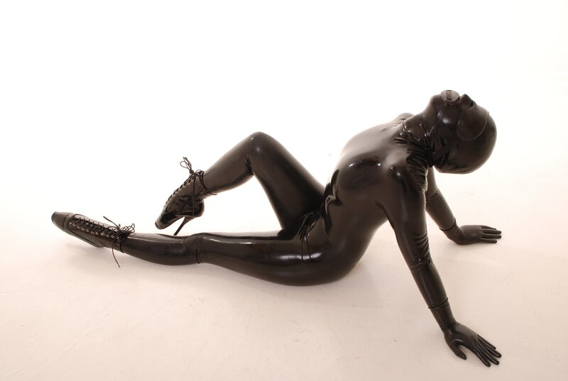 person in black latex suit