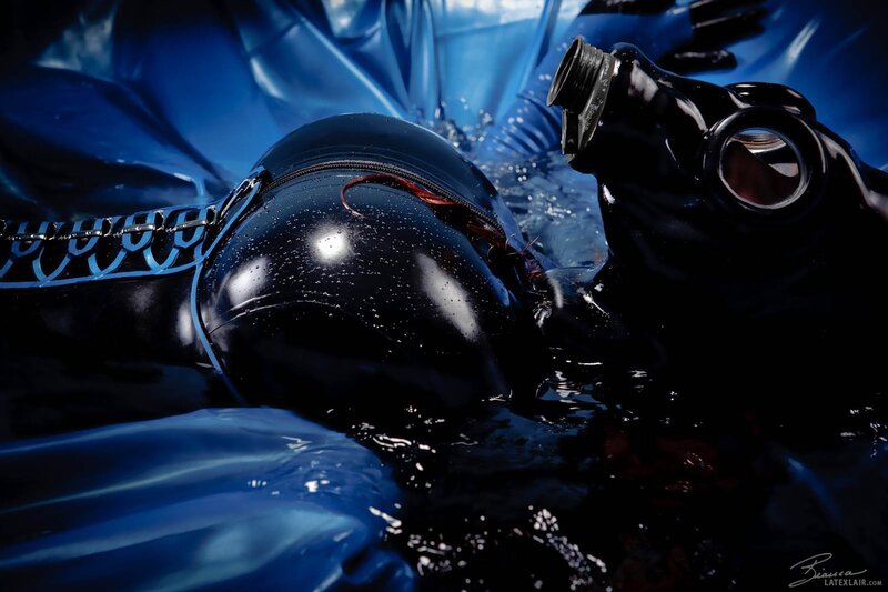 person in black latex suit