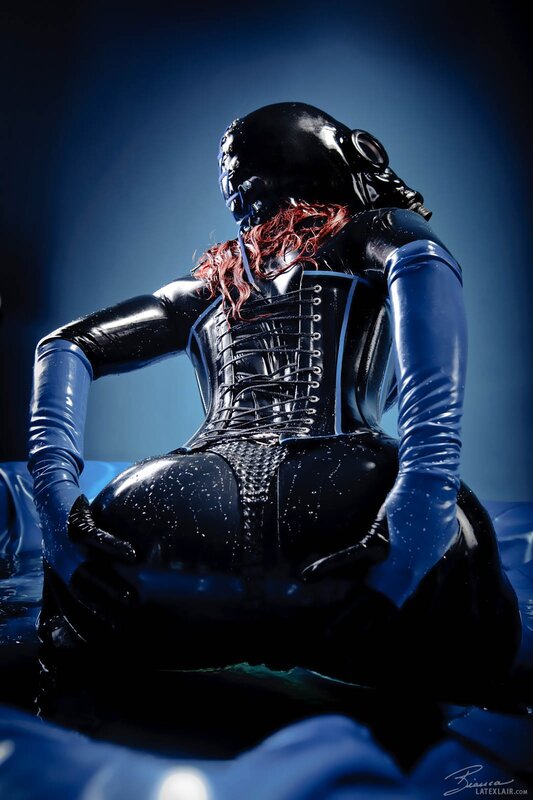 person in black latex suit