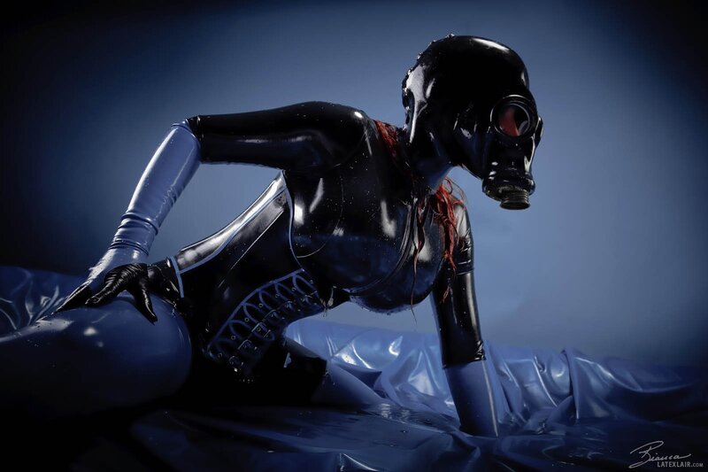 person in black latex suit