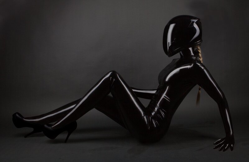 person in black latex suit