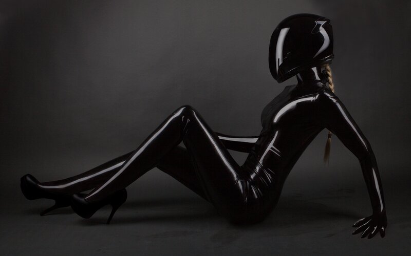 person in black latex suit