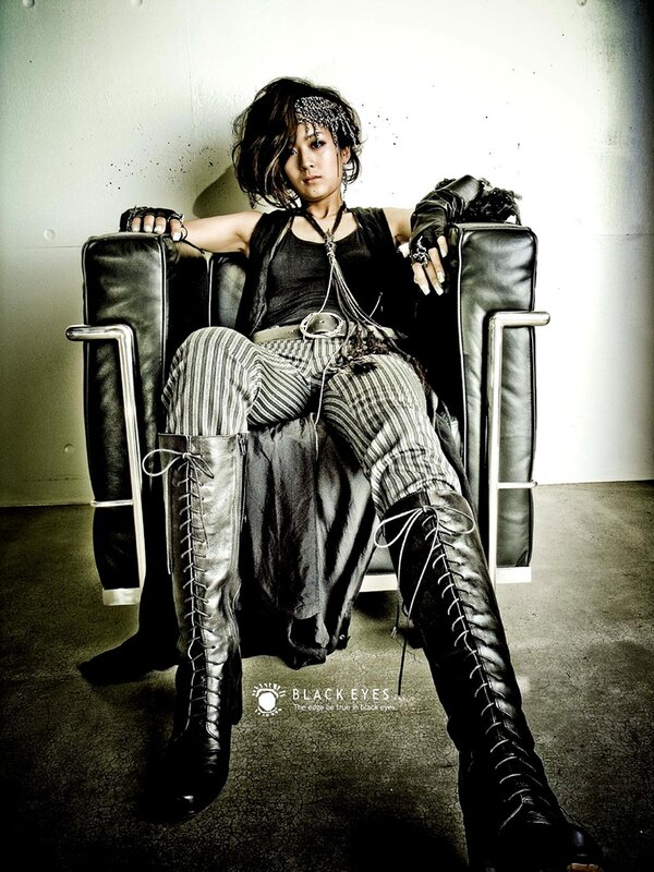 person in black leather chair