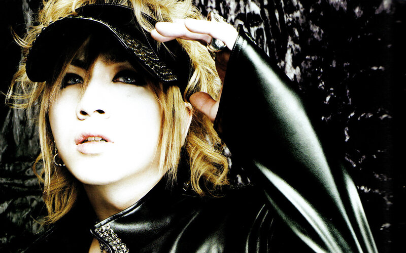 person in black leather outfit