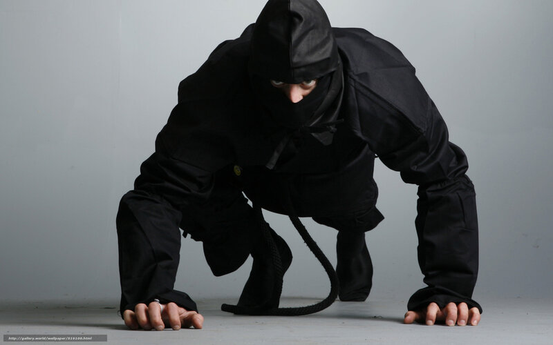 person in black ninja outfit