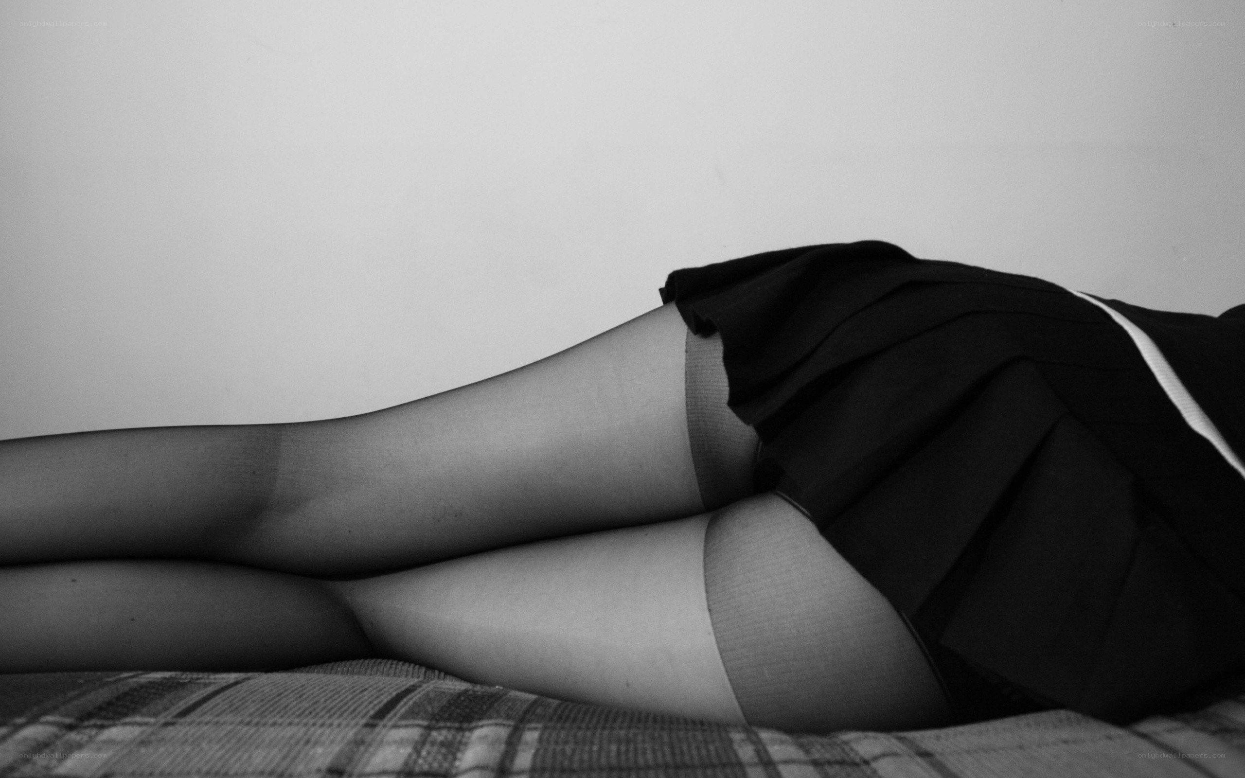 person in black skirt lying down