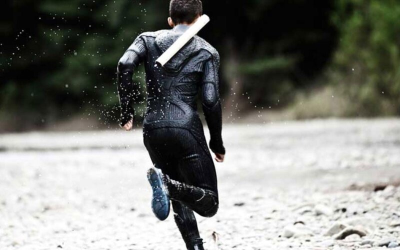 Person in Black Suit Running