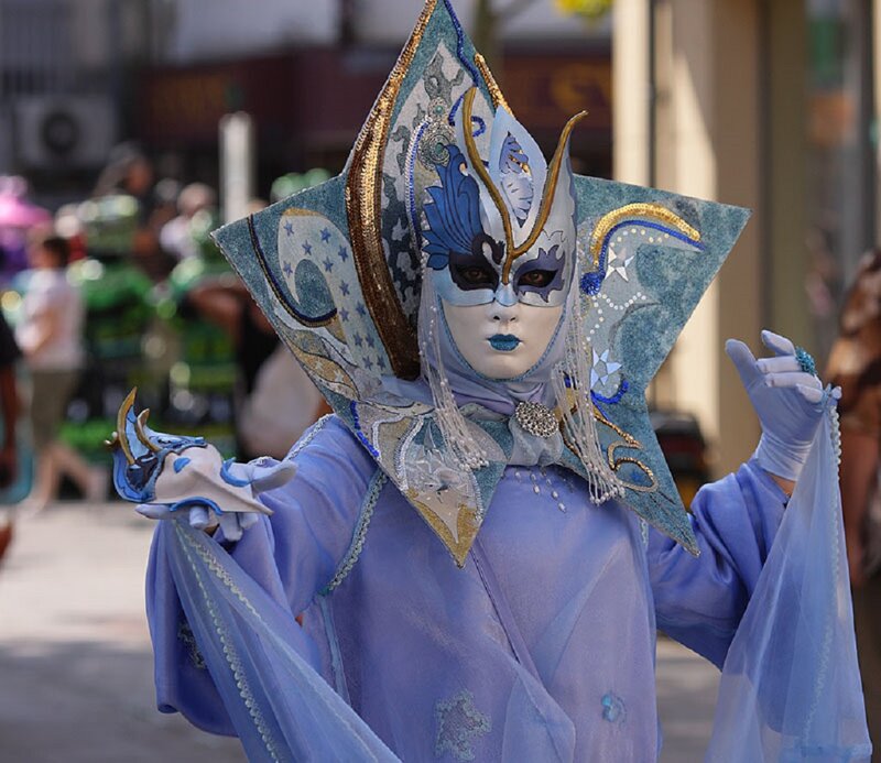 Person in Blue Costume — Dramatic, Afternoon
