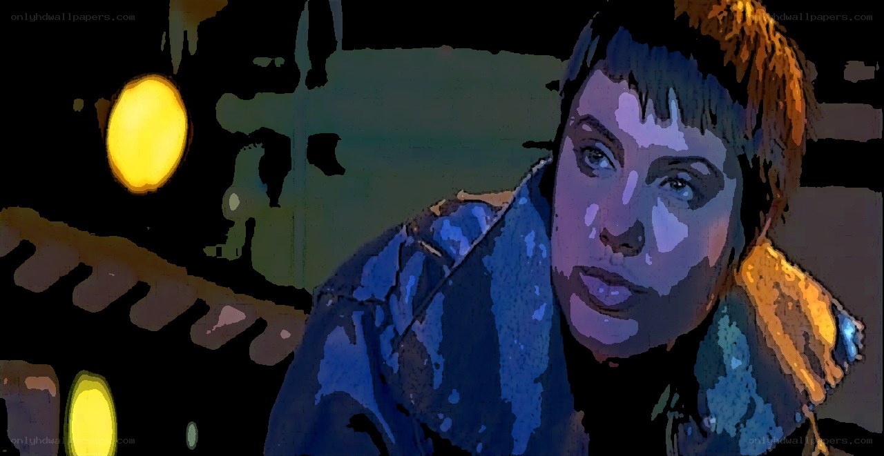 person in blue jacket at night