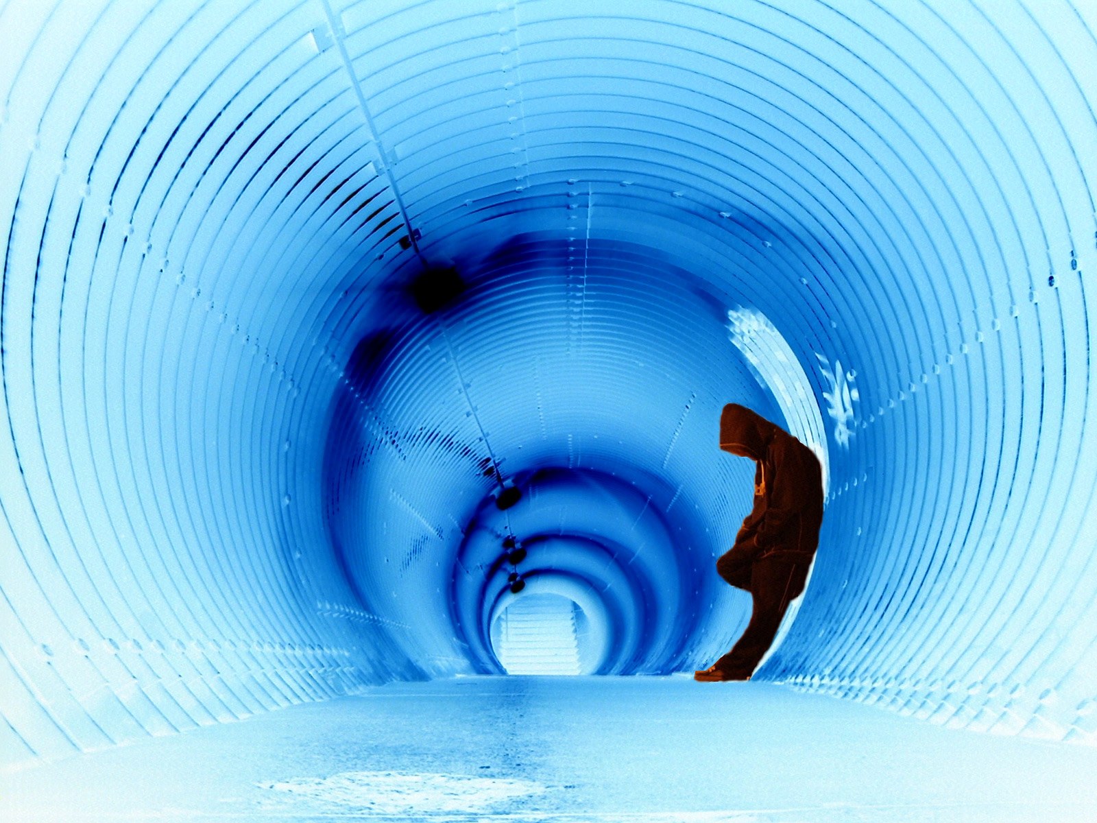 Person in blue tunnel