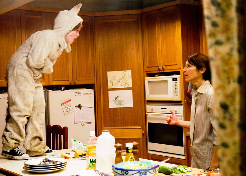 person in bunny costume in kitchen