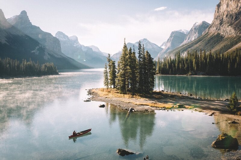 Person in Canoe on Lake — Blue, Serene, Morning, Photograph, Mountains