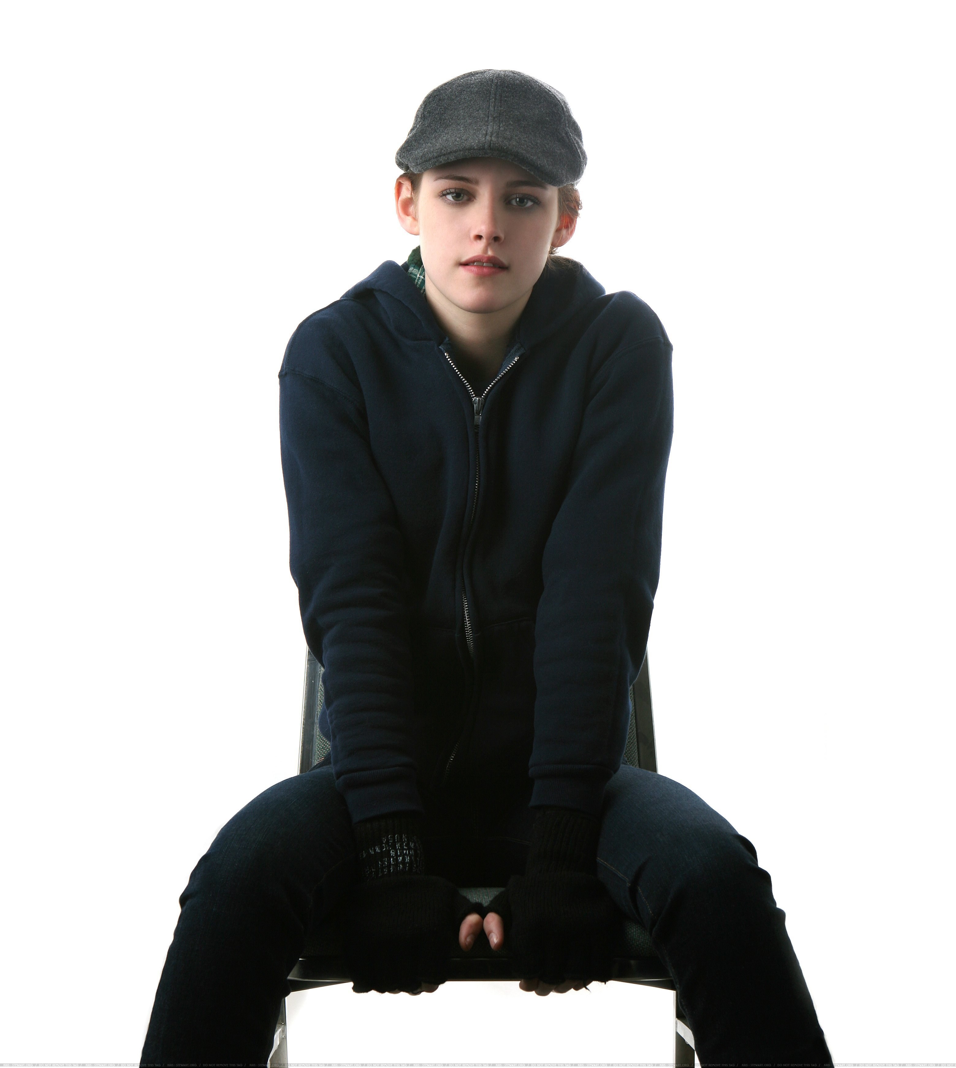 person in cap and hoodie