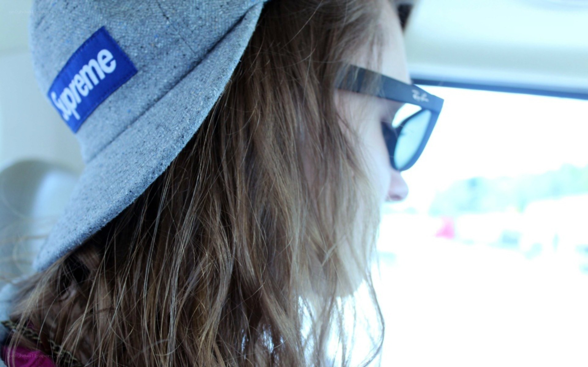 person in cap and sunglasses