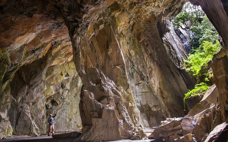 Person in Cave — Brown, Dramatic