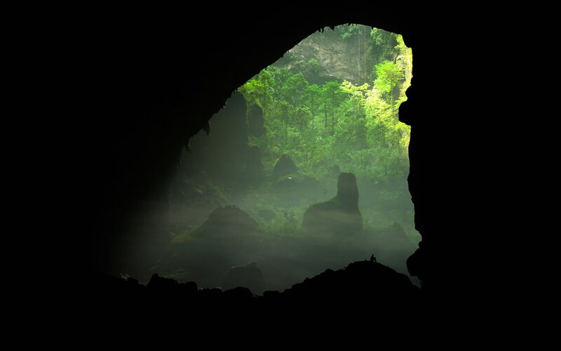 Person in Cave Entrance — Black