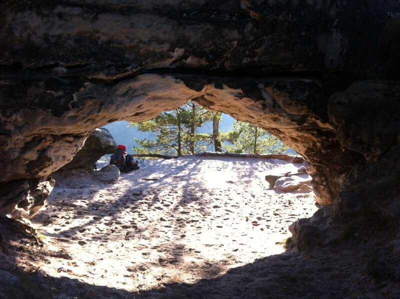 Person in Cave Entrance — Brown, Serene, Afternoon
