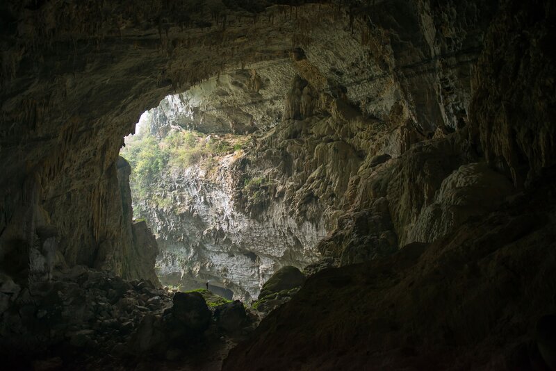 Person in Cave Entrance — Gray