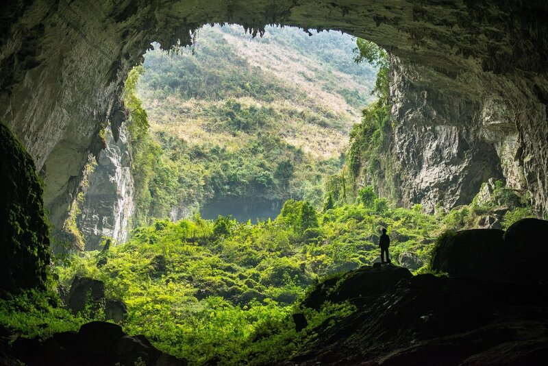 Person in Cave Entrance — Green