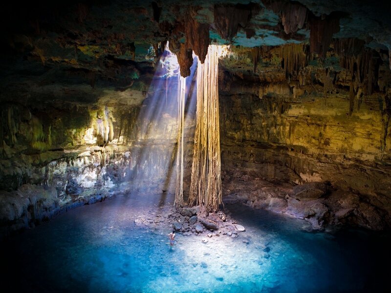 Person in Cave Pool — Blue, Dramatic