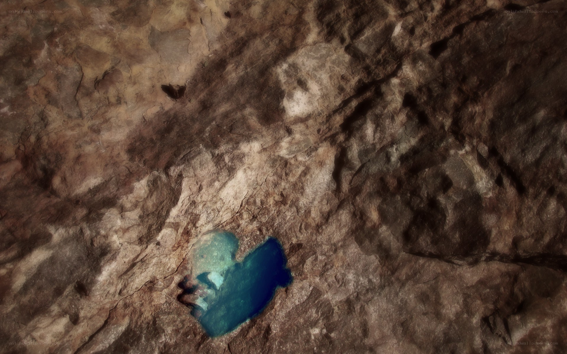 person in cave pool