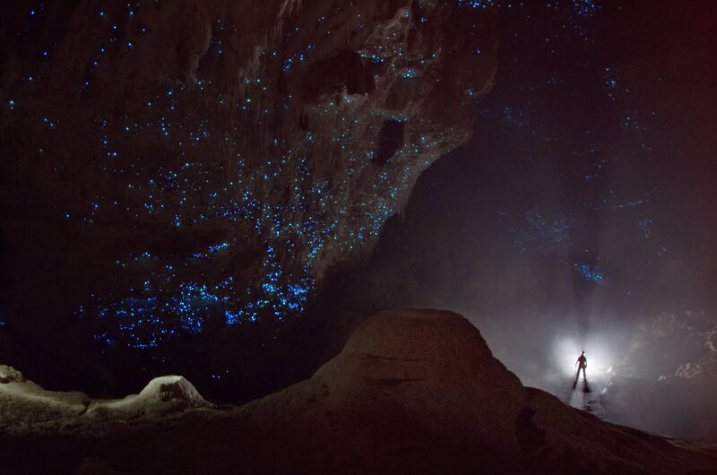 Person in Cave with Glowworms