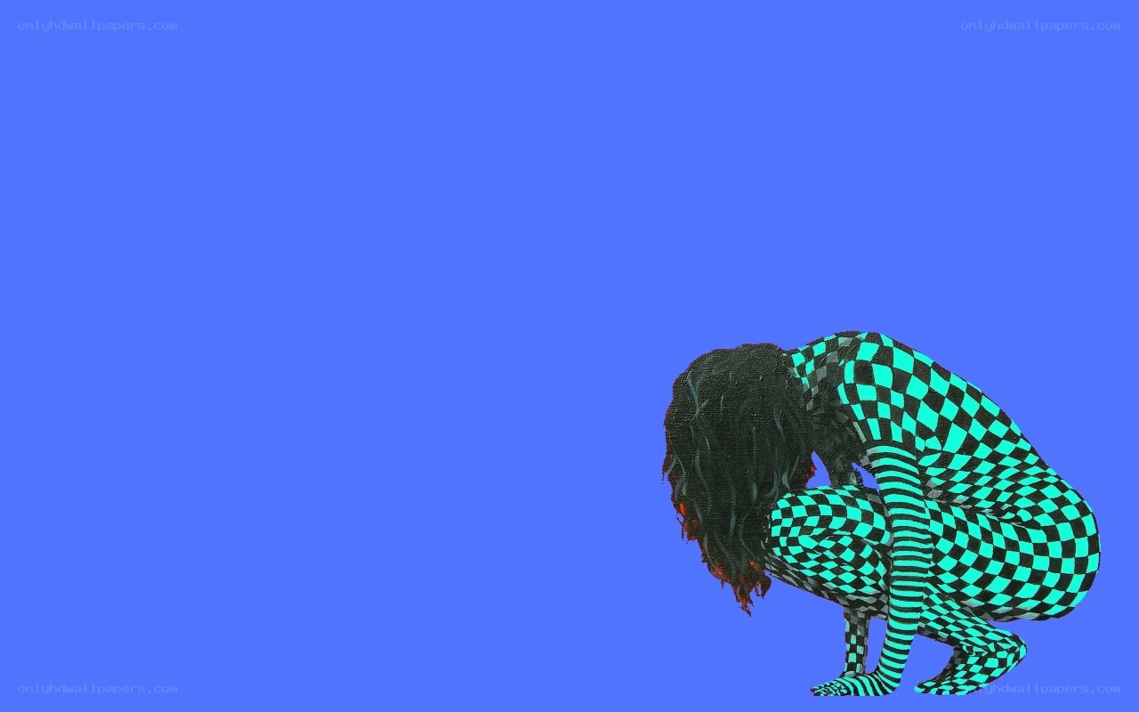 person in checkered suit crouching