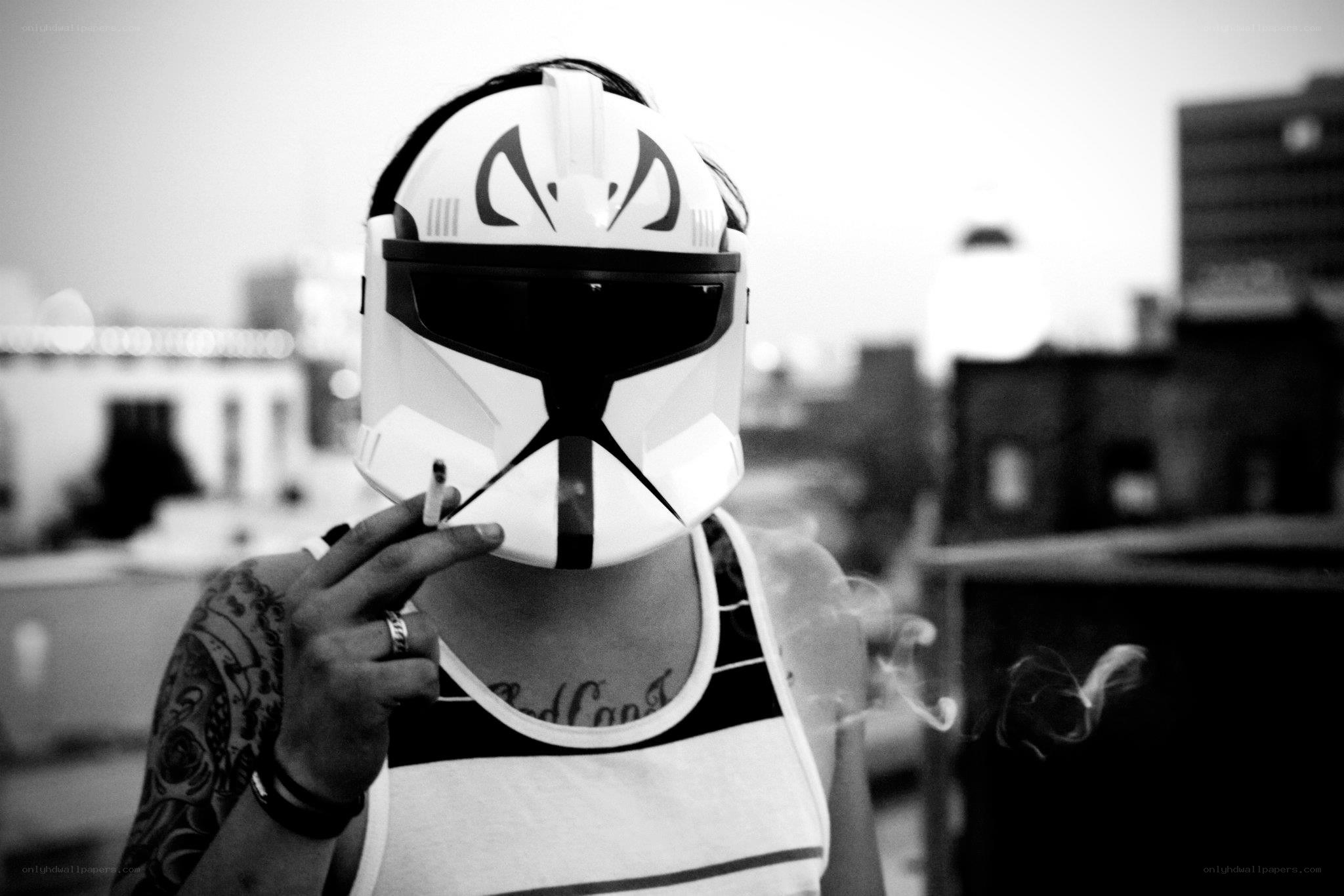 person in clone helmet smoking