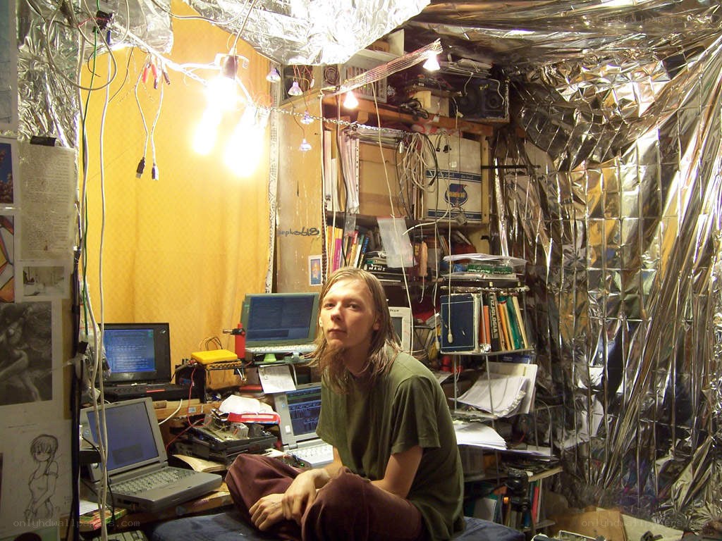 Person in cluttered tech room