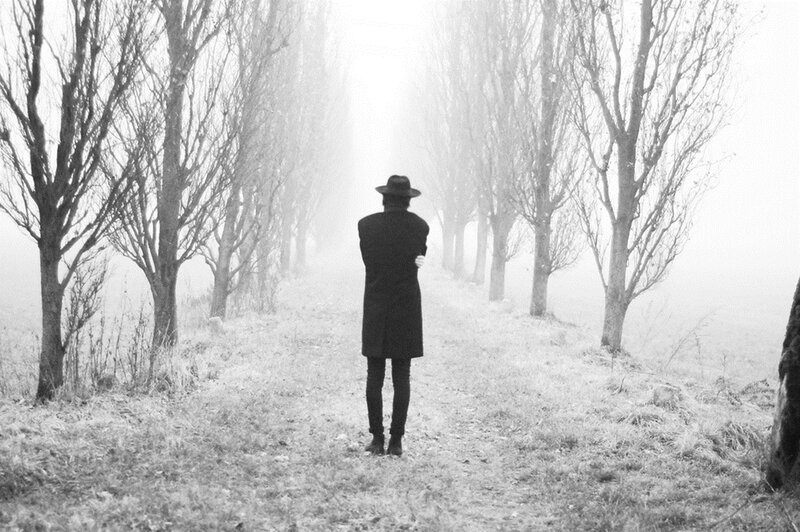 Person in Coat and Hat