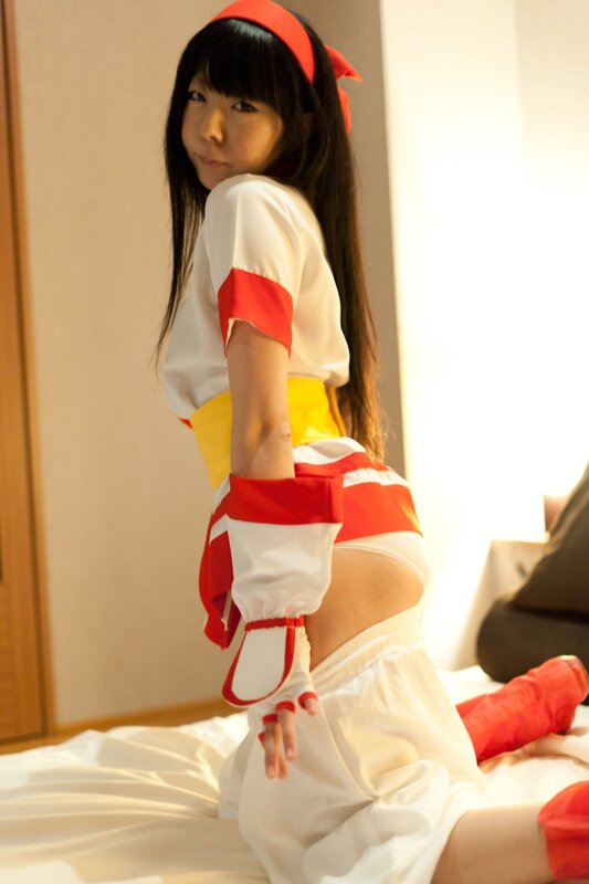 Person in Cosplay Costume — White, Neutral, Photograph, Bed, Room