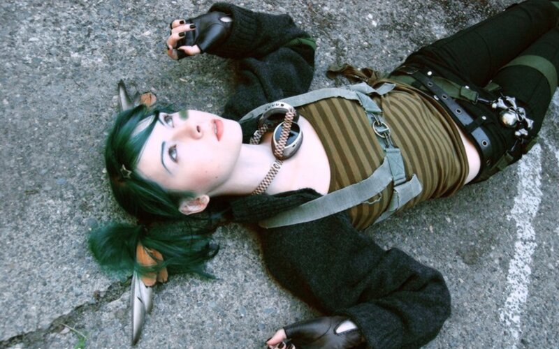 person in cosplay lying on ground