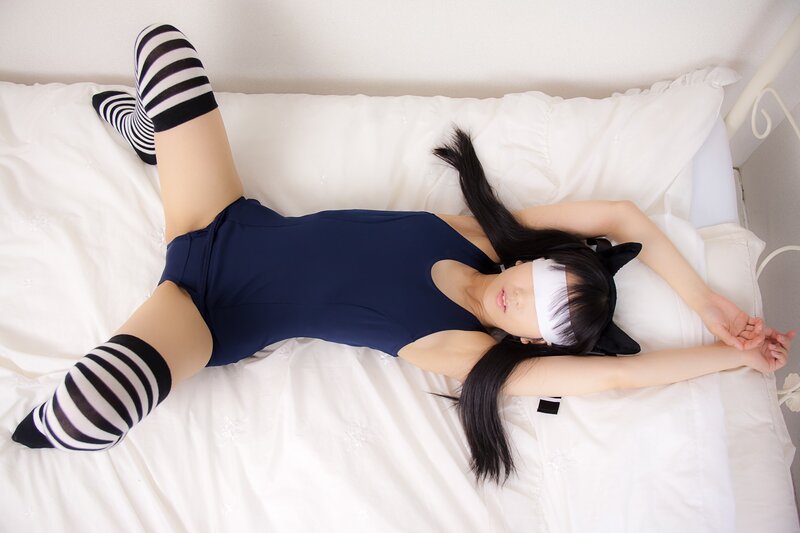 Person in Costume on Bed — White, Relaxed